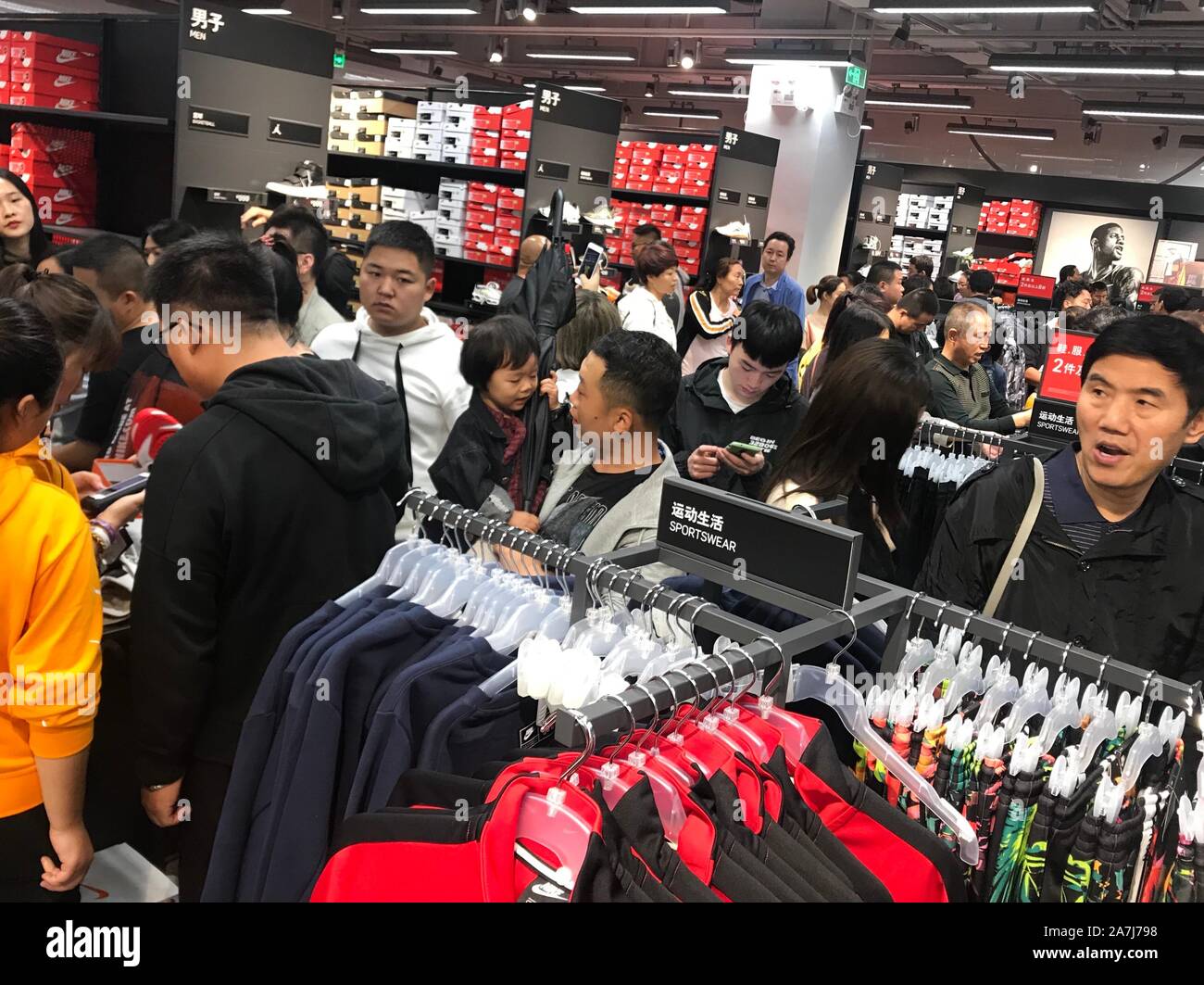 Consumers select and buy products at a Nike store at the newly-opened  Capital Outlets in Xi'an city, Northwest China's Shaanxi province, 14  September Stock Photo - Alamy