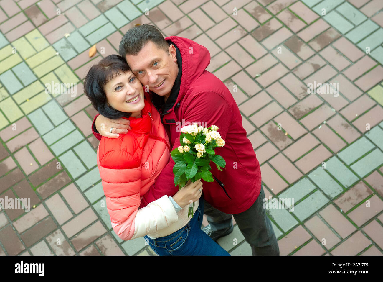 Mature couple with a bouquet of flowers. Mature couple. Stock Photo