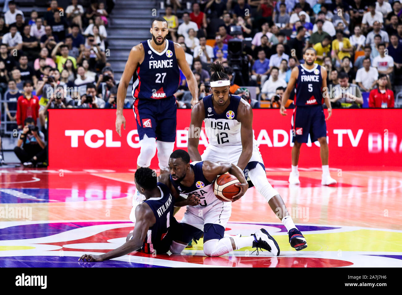 Frank Ntilikina of France, left, and Kemba Walker of the USA, middle,  struggle for the ball during FIBA Basketball World Cup 2019 quarter final  match Stock Photo - Alamy