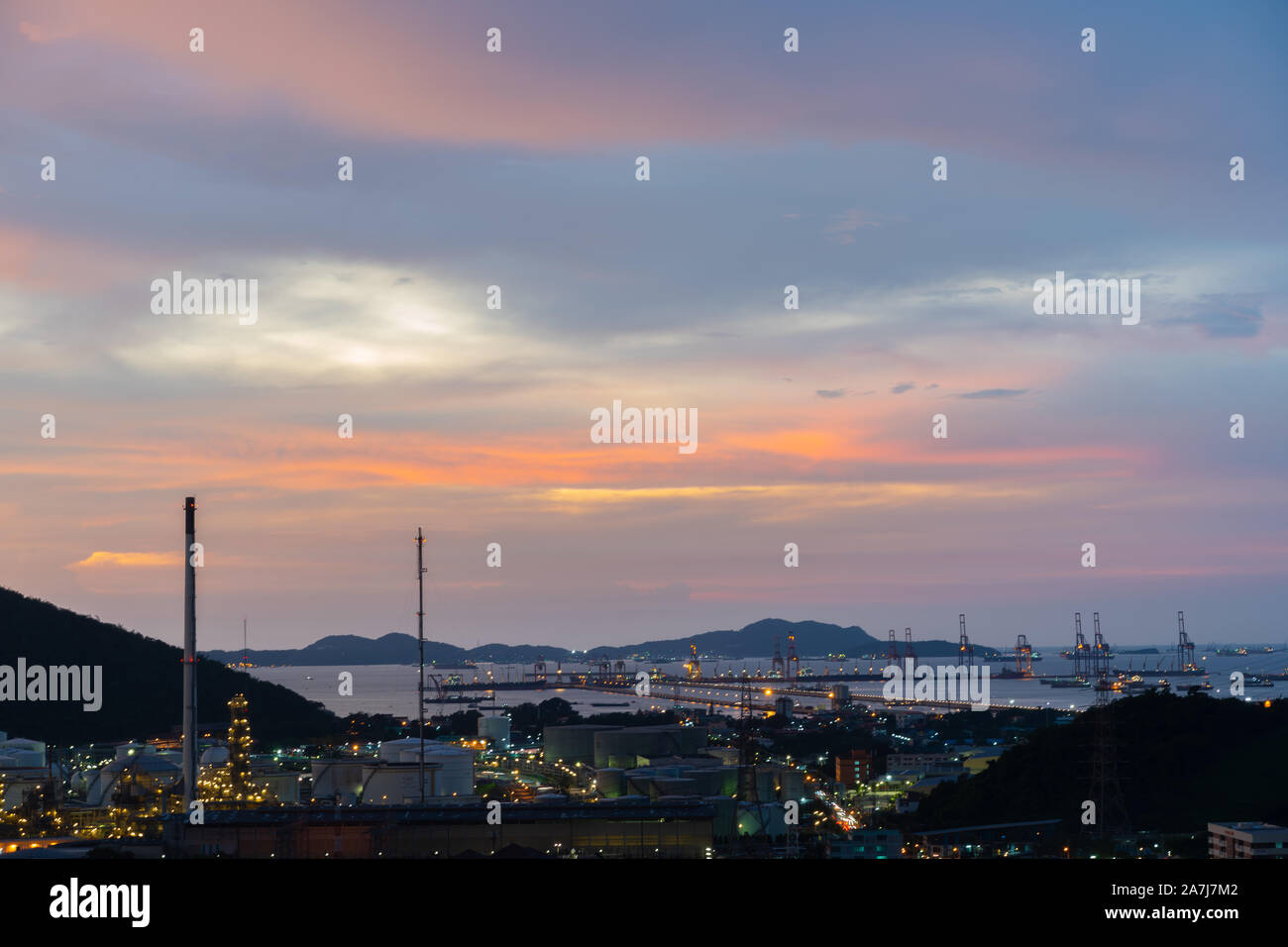 The Oil Or Gas Refinery At Sunset. A silhouette of an oil or gas ...
