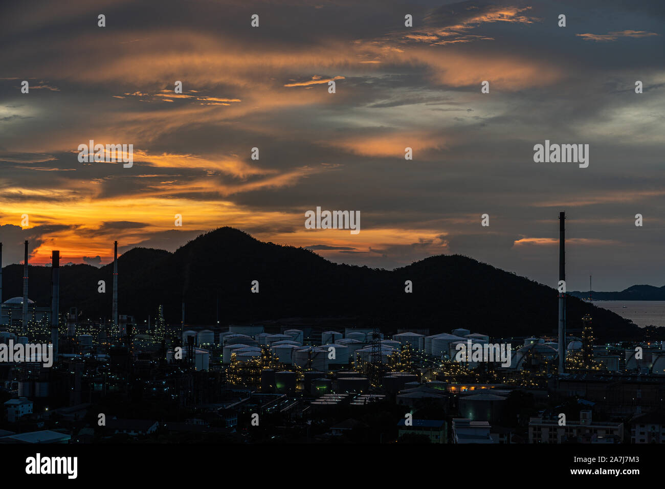 The Oil Or Gas Refinery At Sunset. A silhouette of an oil or gas ...