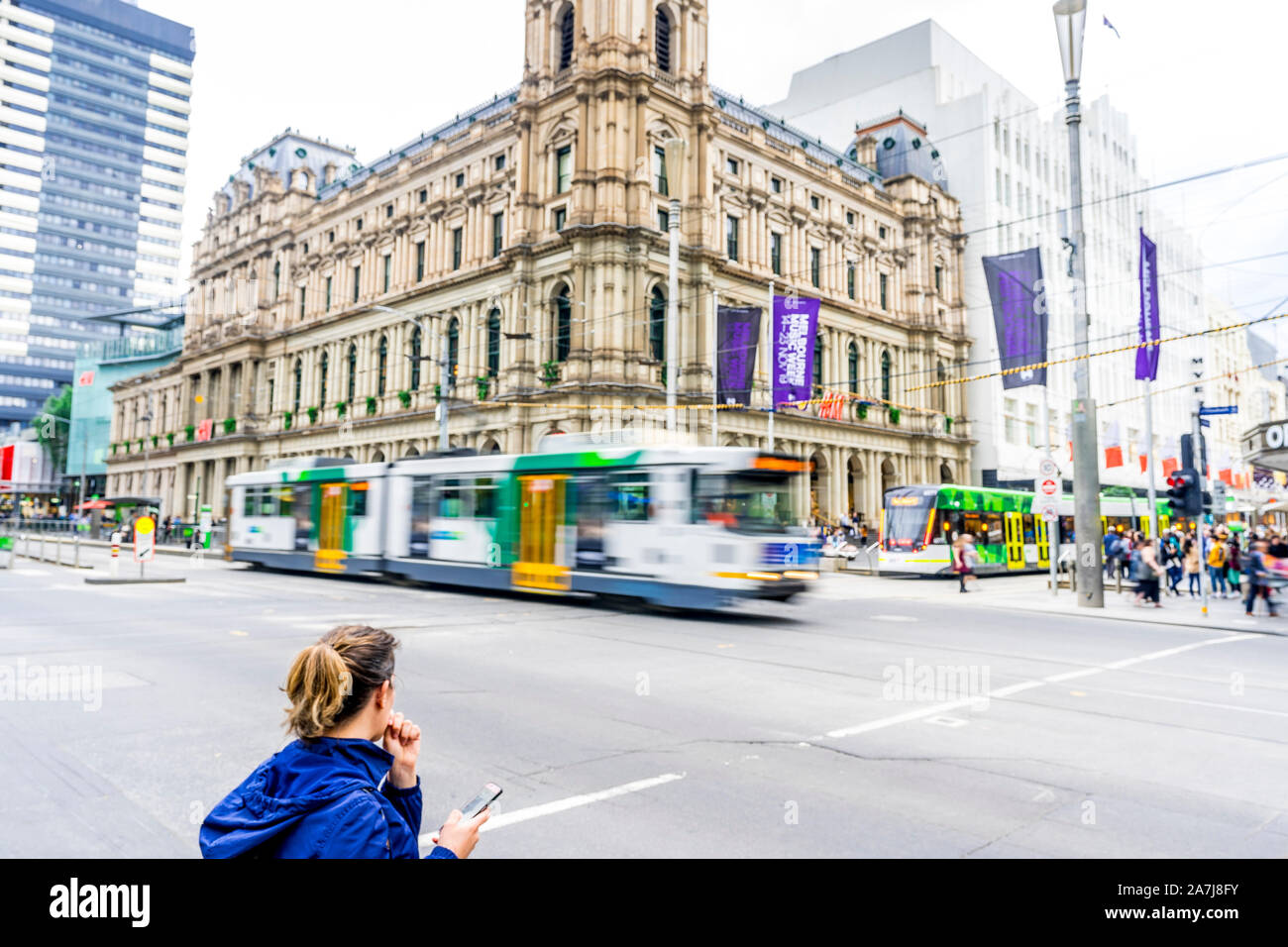 03 Nov 19. A tram passes along a busy intersection in the city of Melbourne, Victoria, Australia. Stock Photo