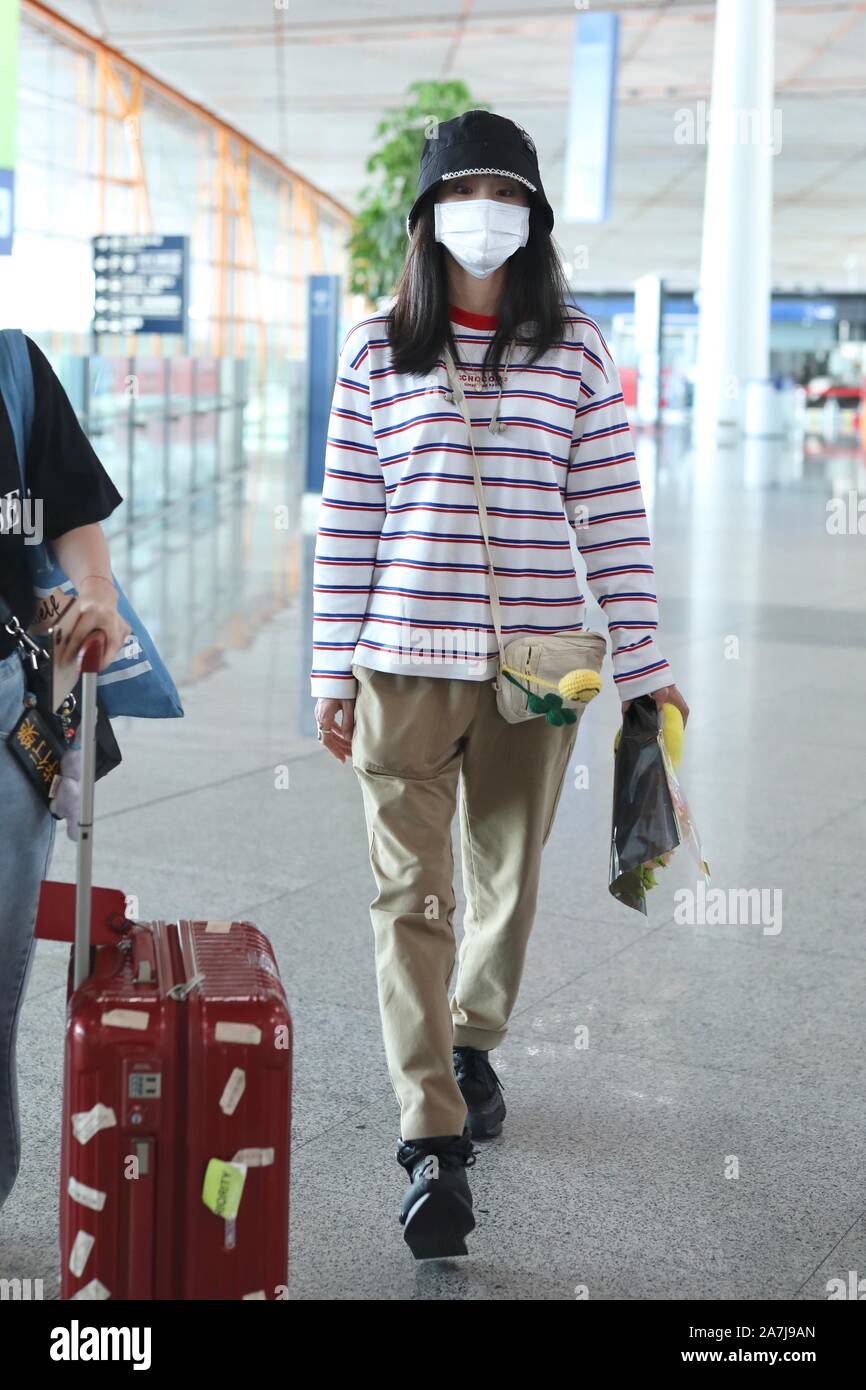 Chinese singer Zhang Bichen or Diamond Zhang arrives at the Beijing ...