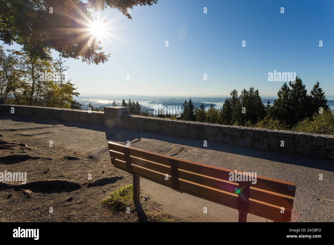 A park bench at the lookout at Cypress Mountain that overlooks downtown Vancouver. Stock Photo