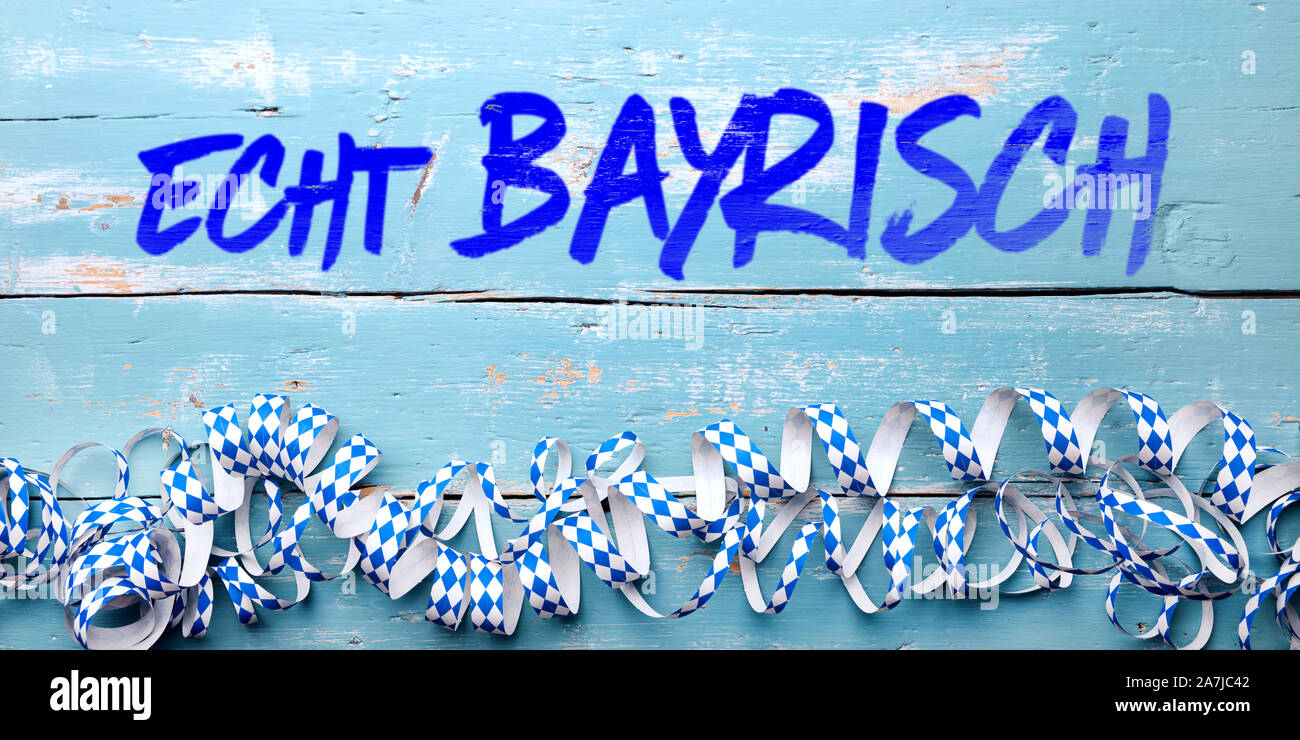 Bavarian Background with blue streamers and german text echt bayrisch, which means original bavarian Stock Photo