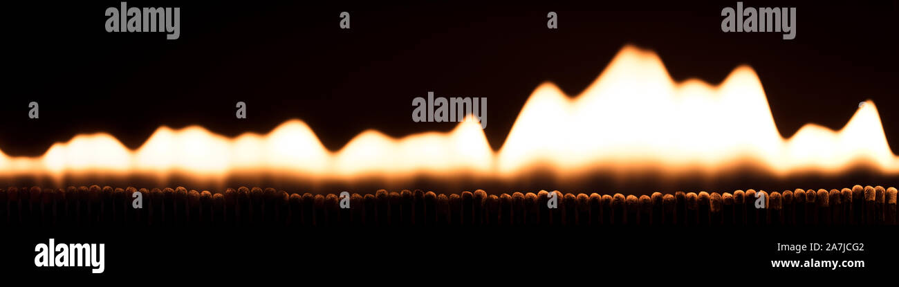 Panorama, lots of matchsticks are burning in fire and flames, black background Stock Photo