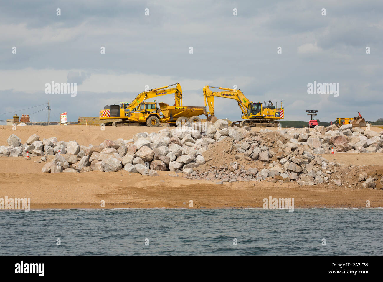 Work being carried out on the beach at West Bay in 2019 to protect it from storms following flooding in the storms of 2014. Dorset England UK GB Stock Photo