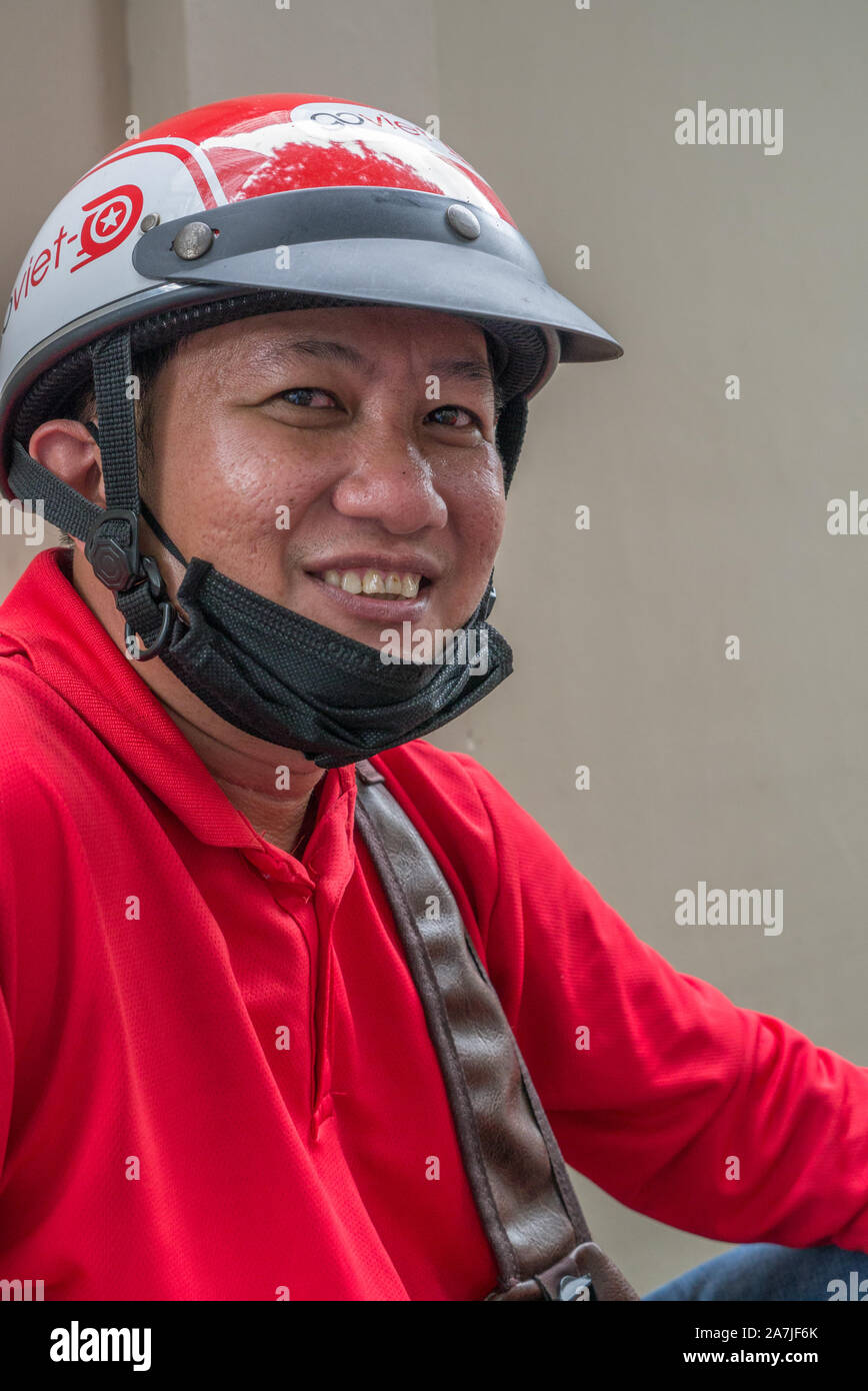 big motorcycle helmets ho chi minh Smiling portrait of GoViet motorcycle taxi drivers in Ho Chi Minh City  Vietnam. Wearing bright red GoViet jackets and shiny red helmets Stock  Photo