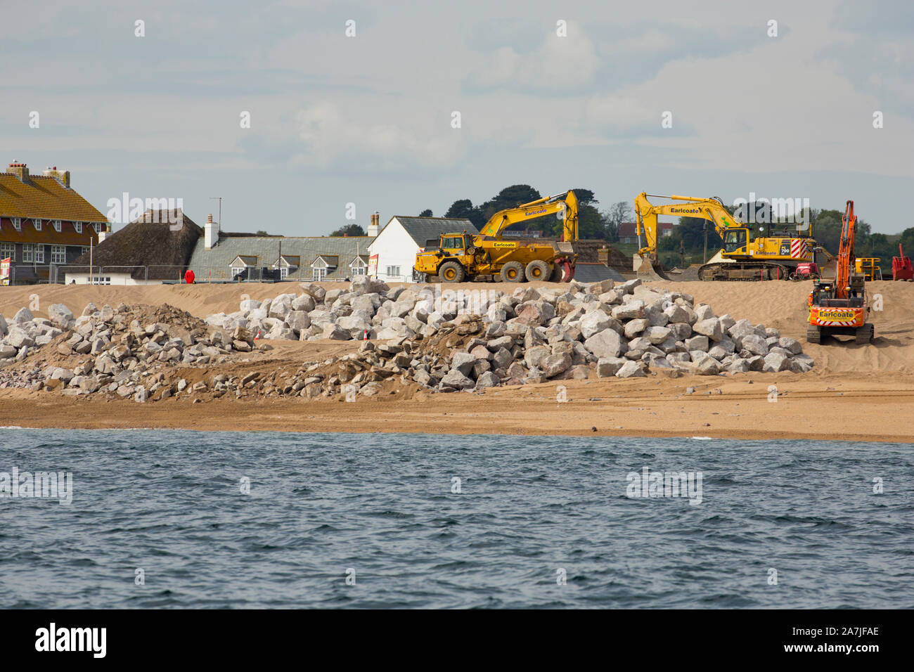 Work being carried out on the beach at West Bay in 2019 to protect it from storms following flooding in the storms of 2014. Dorset England UK GB Stock Photo