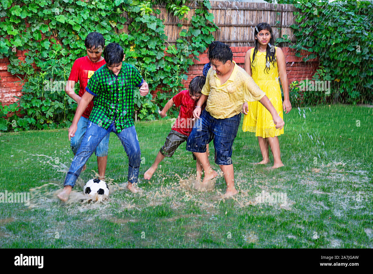 Rainy kids football game hires stock photography and images Alamy