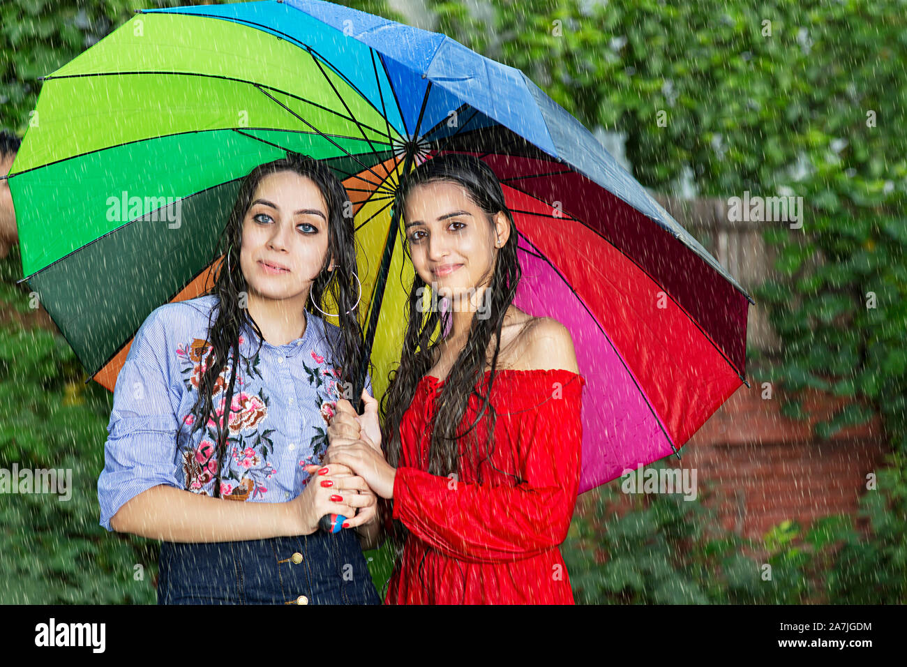 Two friends with umbrella hires stock photography and images Alamy