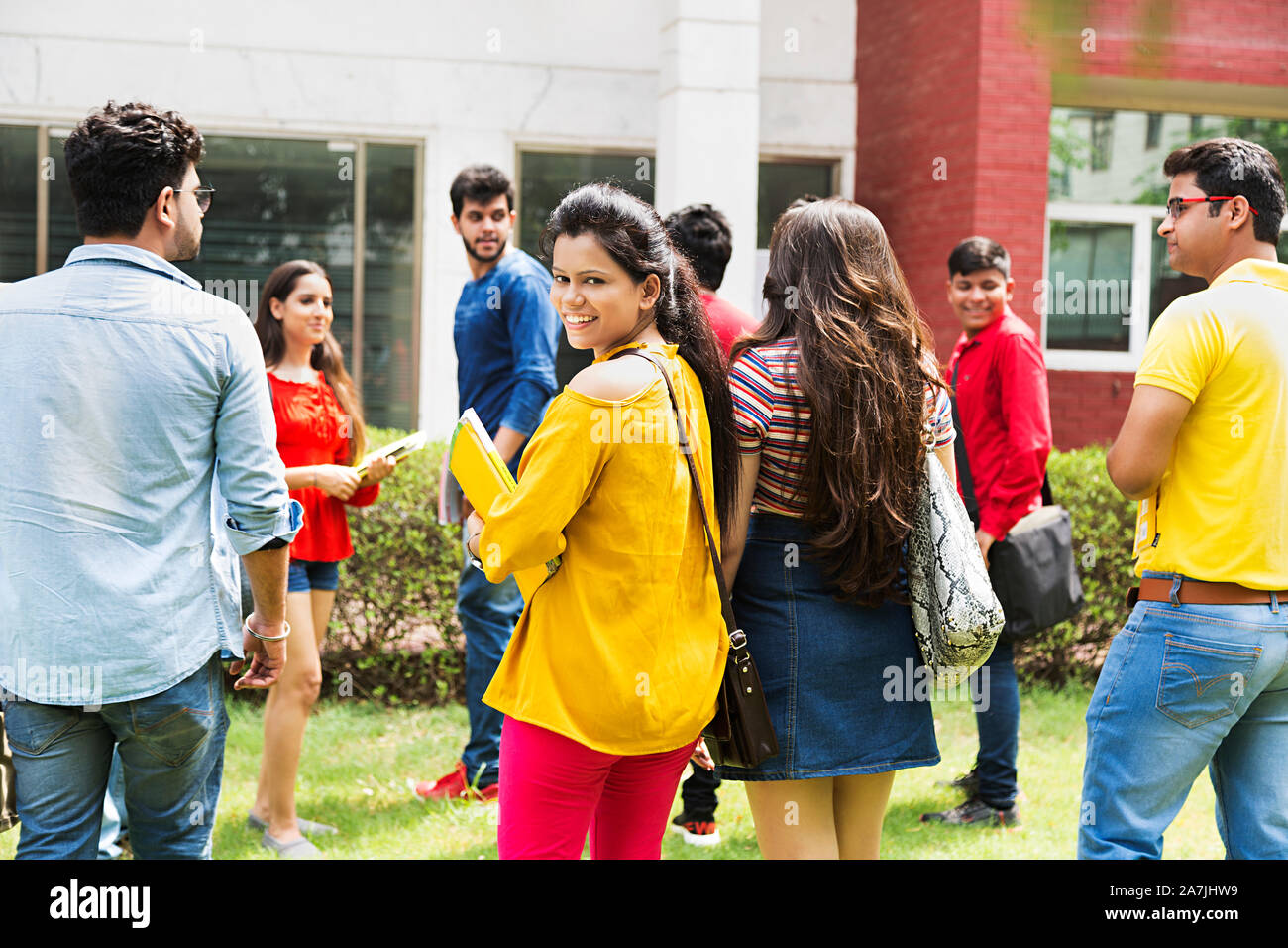 Group Of Young male And Female College Students Classmates Turning At ...
