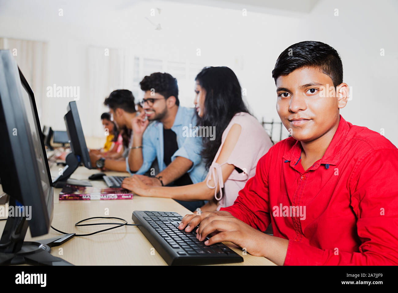 Teenager boy College Student Using Computer Studying E-Learning With ...