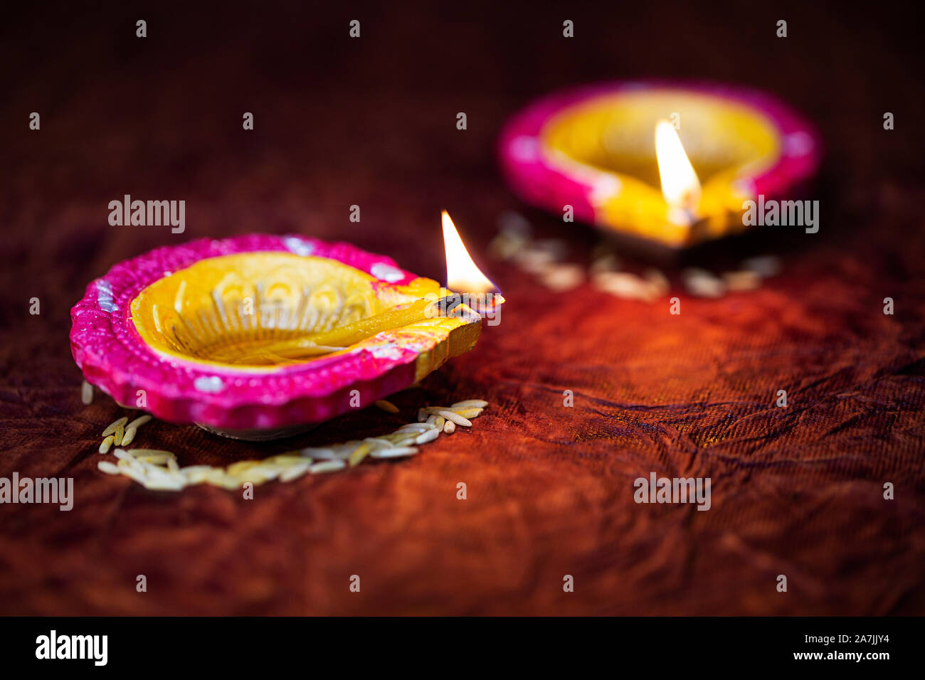Close-Up Of Illuminated Diya Oil Lamp Lighting On During Diwali Festival Celebration Stock Photo