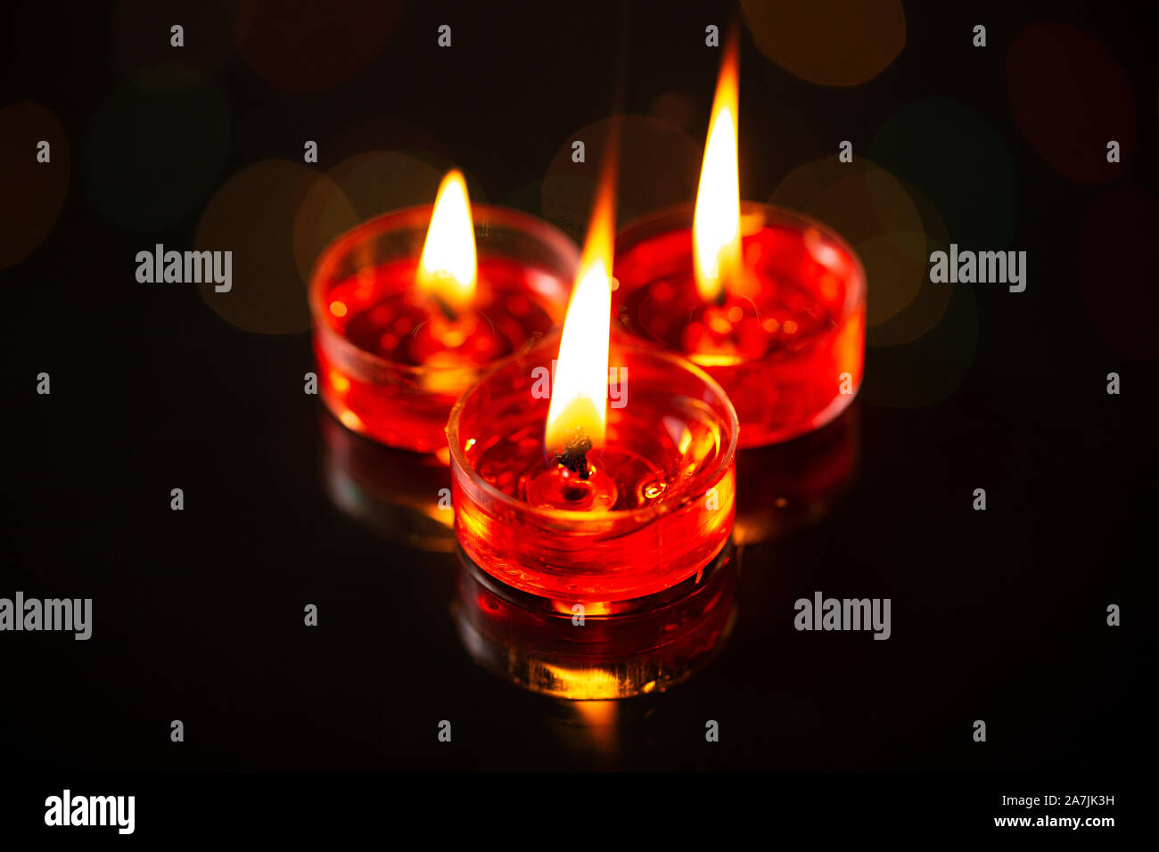 Nobody shot burning candles with blurred lights during Indian festival of Diwali Stock Photo