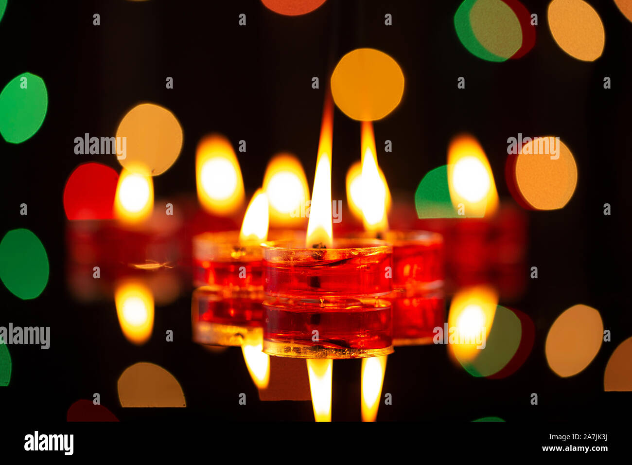 Festival of Lights candlelight. focus on foreground of many burning tealight candles Stock Photo