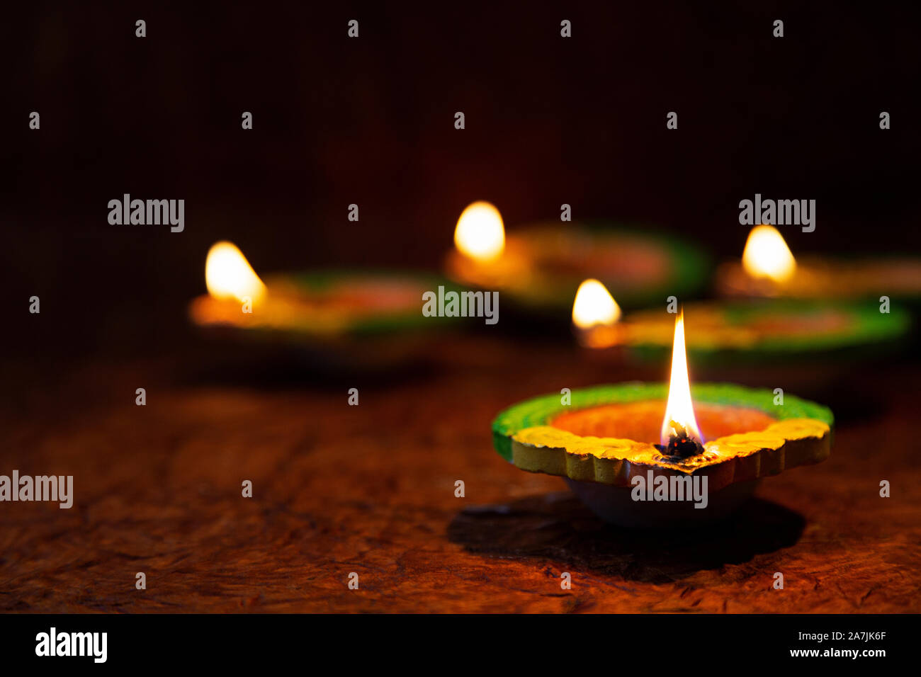 Traditional clay diya oil lamps Lighting Illuminated on Diwali Festival celebration Nobody Stock Photo