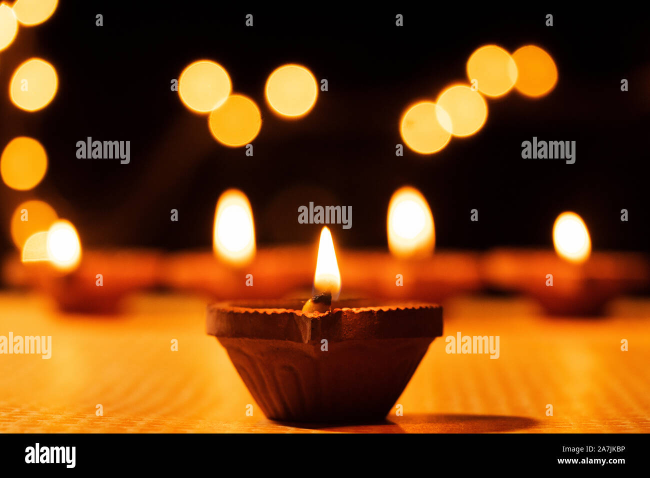 Close-up burning Clay Diya Oil-lamp Lighting Illuminated During Diwali Festival Celebration Stock Photo