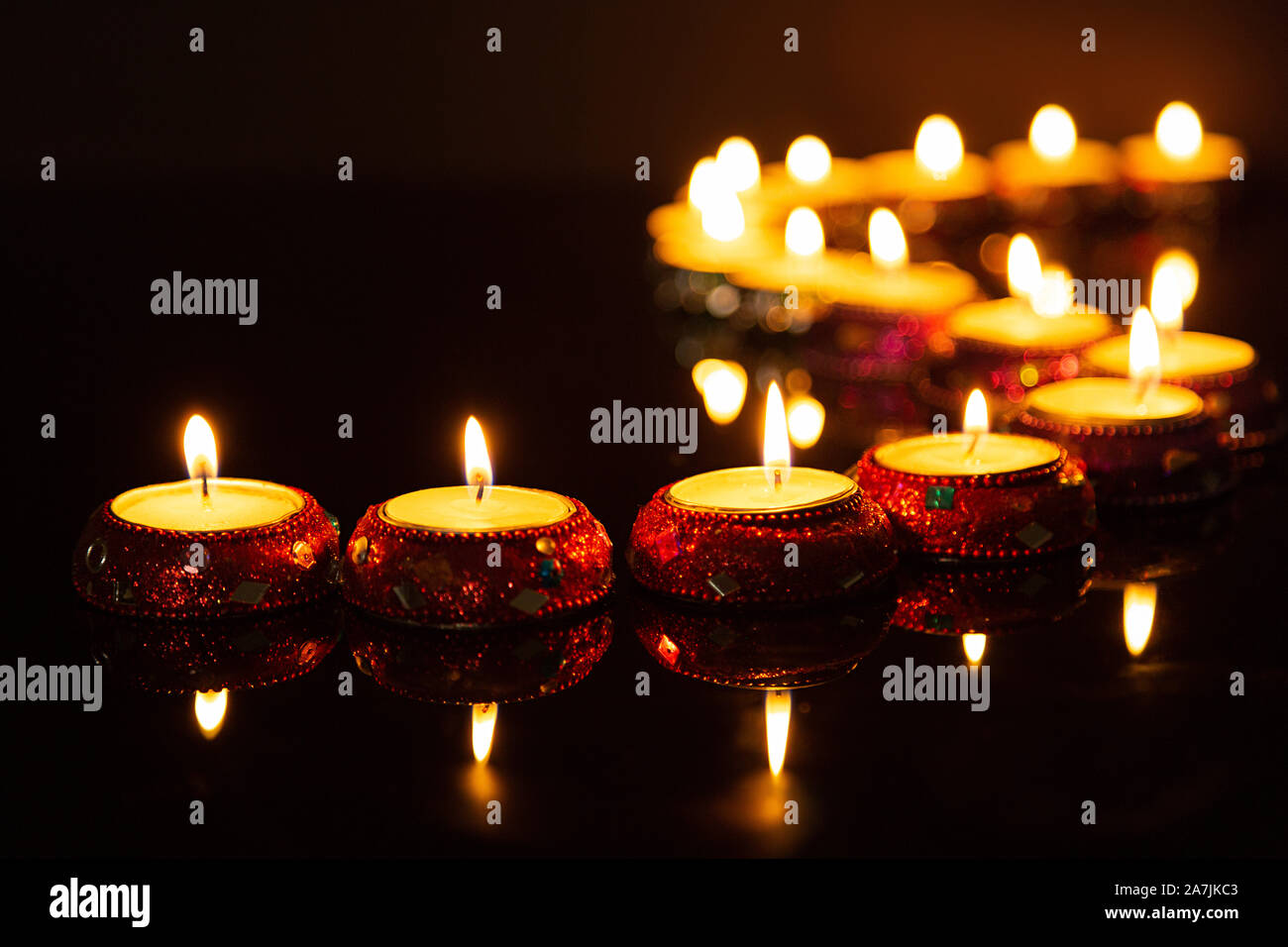 candle light in curve line dark concrete plate background for fill text on space beside Stock Photo