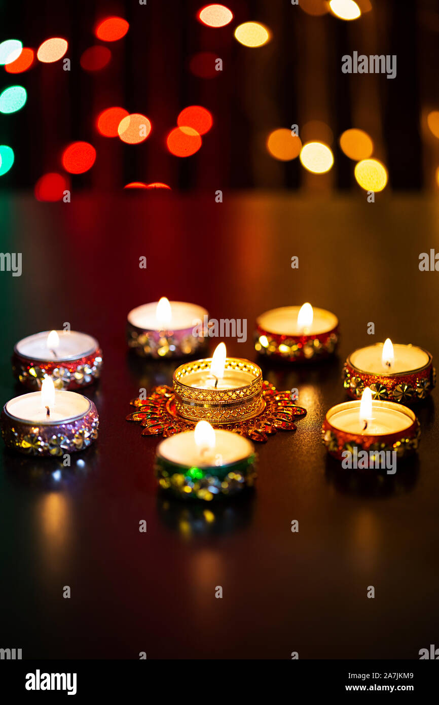 Nobody Shot Burning candle with blurred lights during Diwali Festival Celebration in-india Stock Photo