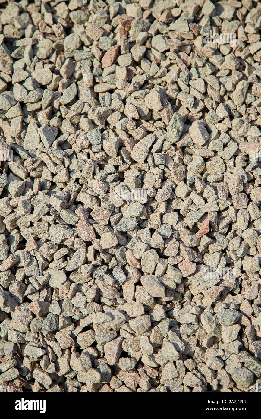 Breakstone background, a pile of crushed stone. Road gravel, gravel texture. Piles of limestone
