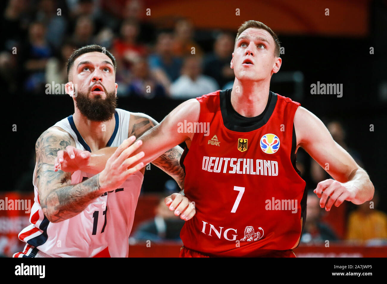 Johannes Voigtmann, right, of Germany national basketball team challenges  Vincent Poirier of France national basketball team in the first found match  Stock Photo - Alamy