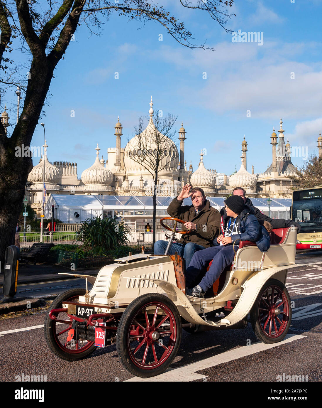 Brighton UK 3rd November 2019 - A 1902 Darracq owned and driven by Allan White passes by the Royal Pavilion in Brighton as they near the finish of the Bonhams London to Brighton Veteran Car Run. Over 400 pre-1905 cars set off from Hyde Park London early this morning and finish at Brighton's Madeira Drive on the seafront : Credit Simon Dack / Alamy Live News Stock Photo