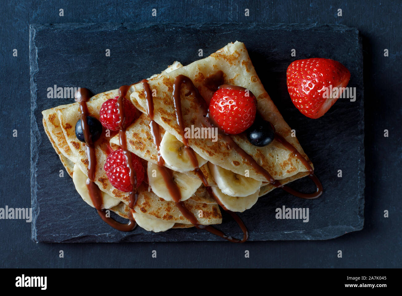 Crepe with banana, strawberry and chocolate Stock Photo - Alamy