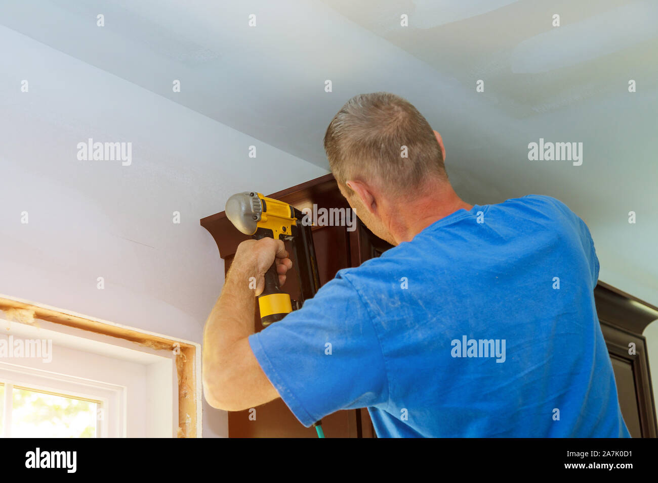 New interior home renovation of modern white kitchen construction