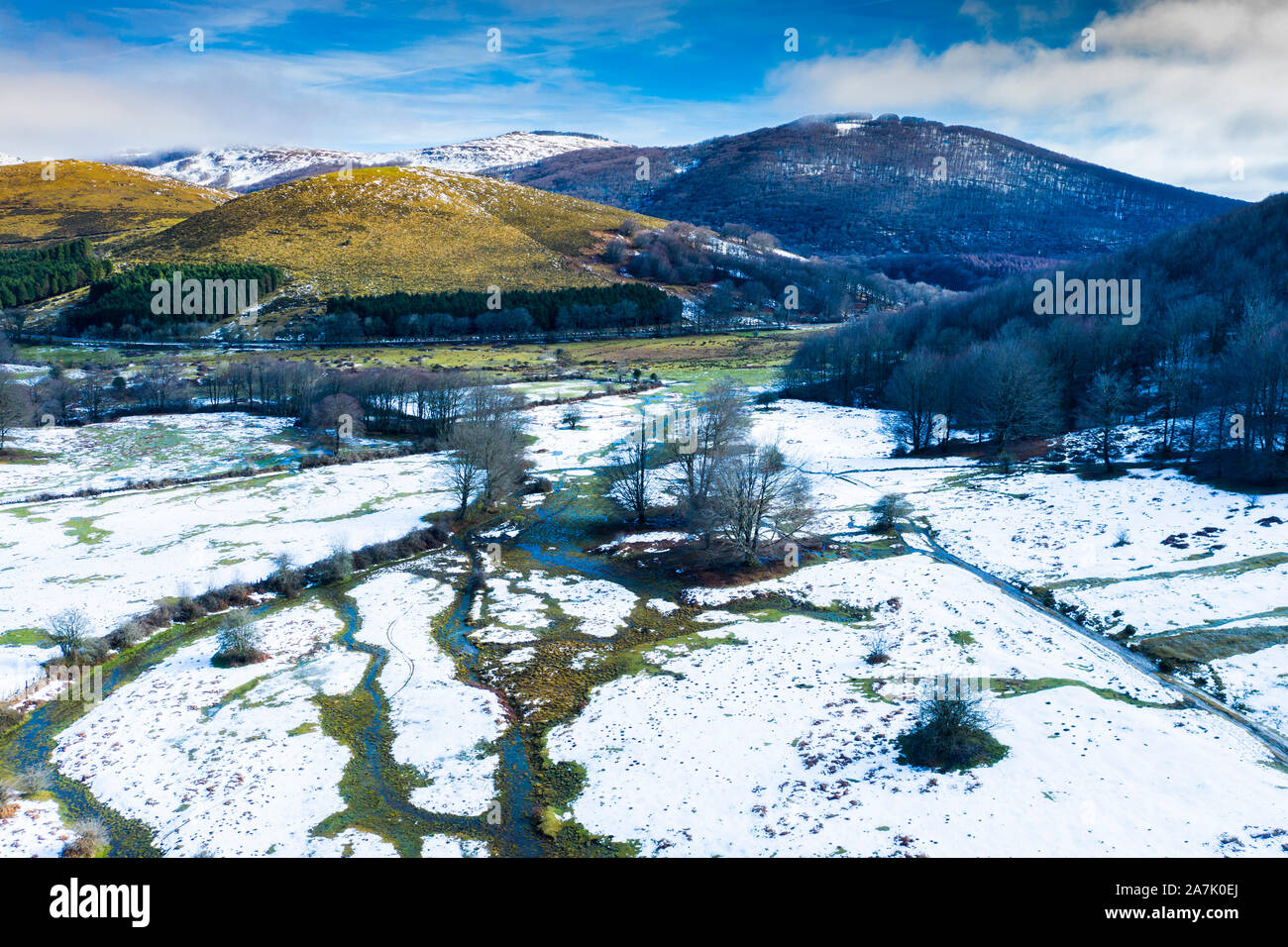 Pasture and mountains in winter. Stock Photo