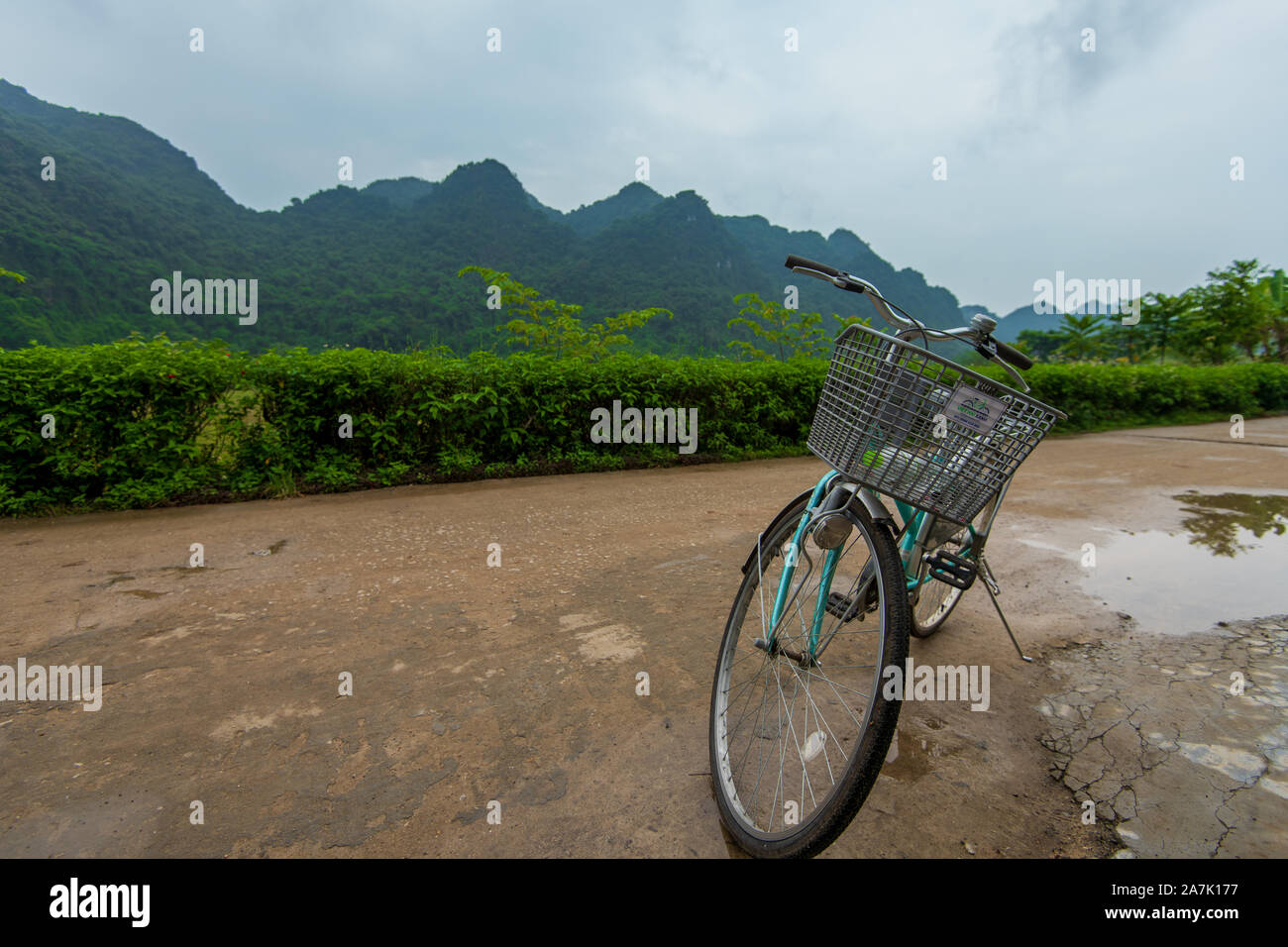 Cat Ba, Vietnam - 15th October 2019: A pushbike stood stationary against the beautiful backdrop of Cat ba Island on Ha Long Bay, Northern Vietnam Stock Photo