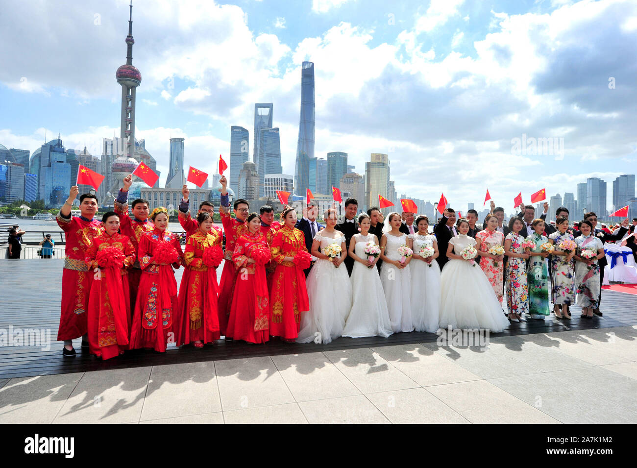 15 couples held group weddings by the Huangpu river to celebrate the 70th anniversary of the founding of PRC in Shanghai, China, 19 September 2019. Stock Photo