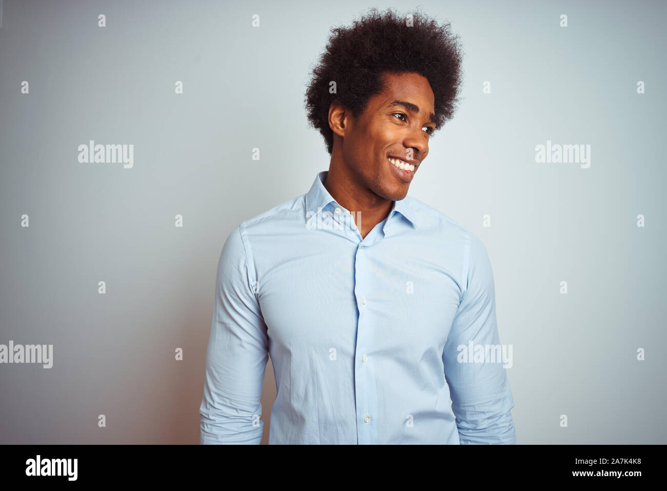 Young African American Man With Afro Hair Wearing Elegant Shirt