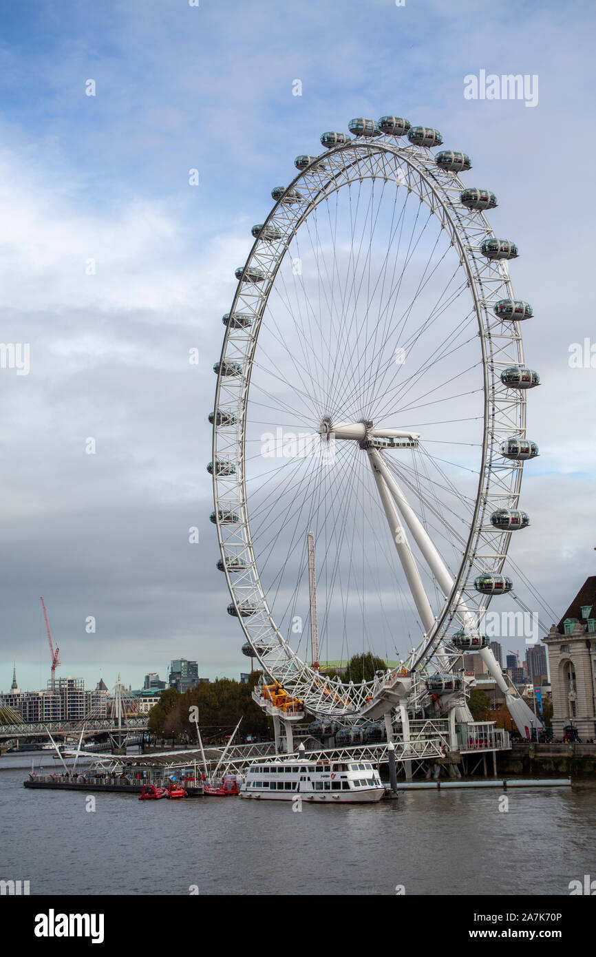 29 October 2019: The Coca-Cola London Eye from Westminster Bridge overlooking the River Thames. Stock Photo