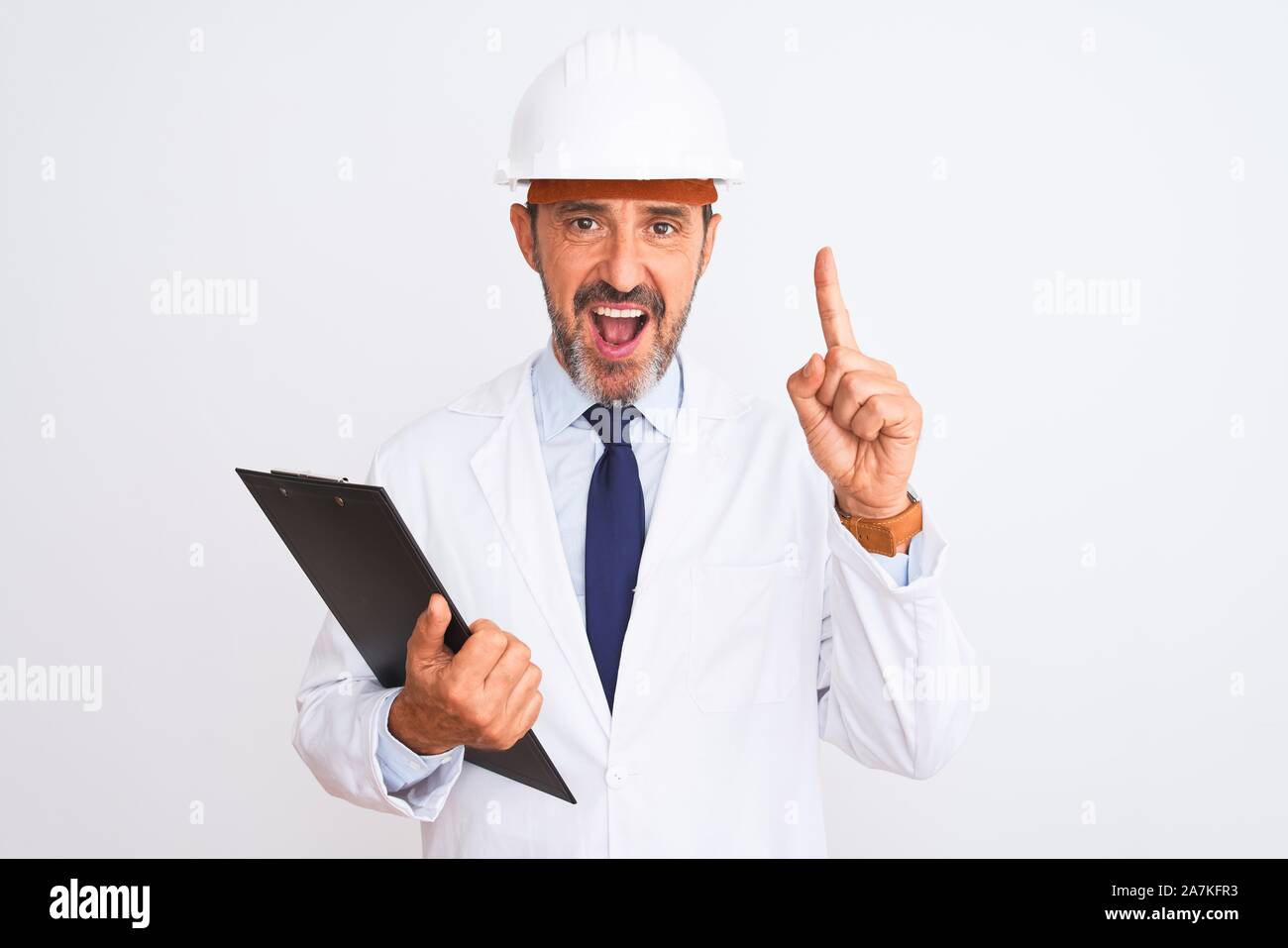 Senior engineer man wearing security helmet holding clipboard over ...