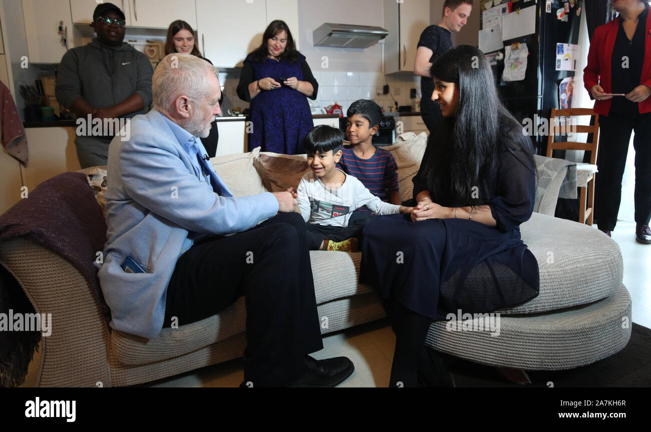 Labour leader Jeremy Corbyn, Elias, Eesa and mother Sabiha during Corbyn's  visit to Clyde House, Putney, London as his party proposes a move to  upgrade almost every home in the UK with