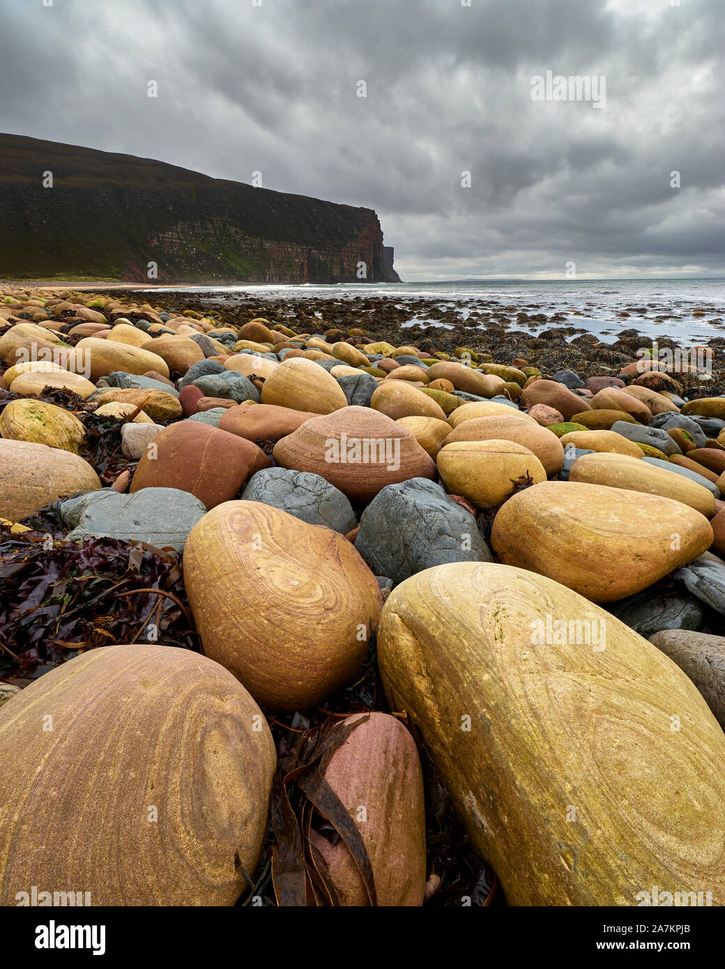 Patterned boulders on Rackwick Bay beach, Hoy, Orkney, Scotland Stock Photo