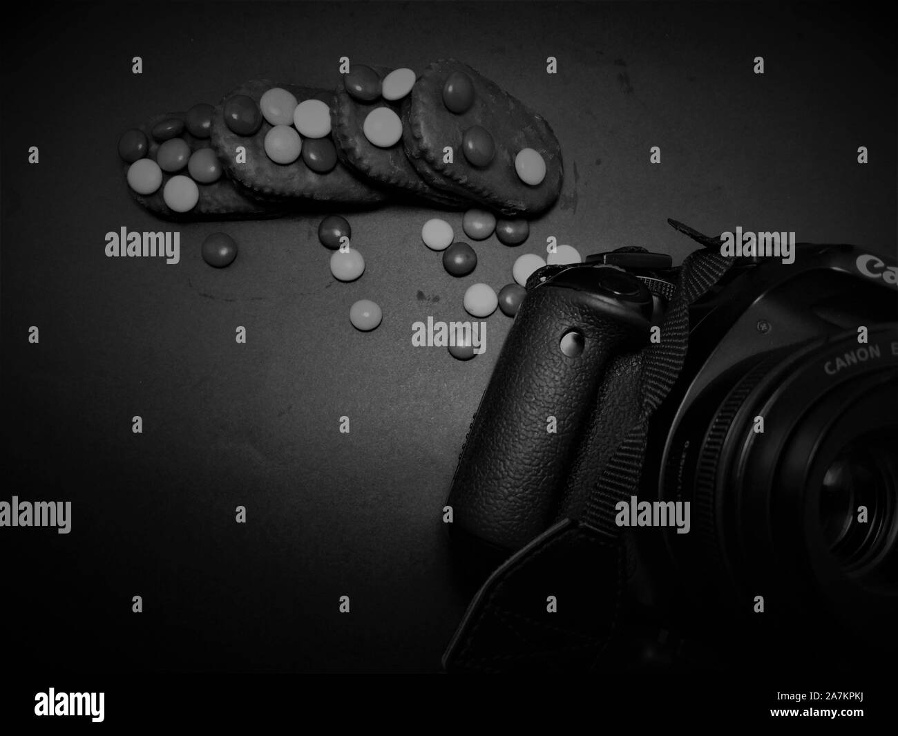 Camera & Chocolate Photography Background Black Stock Photo