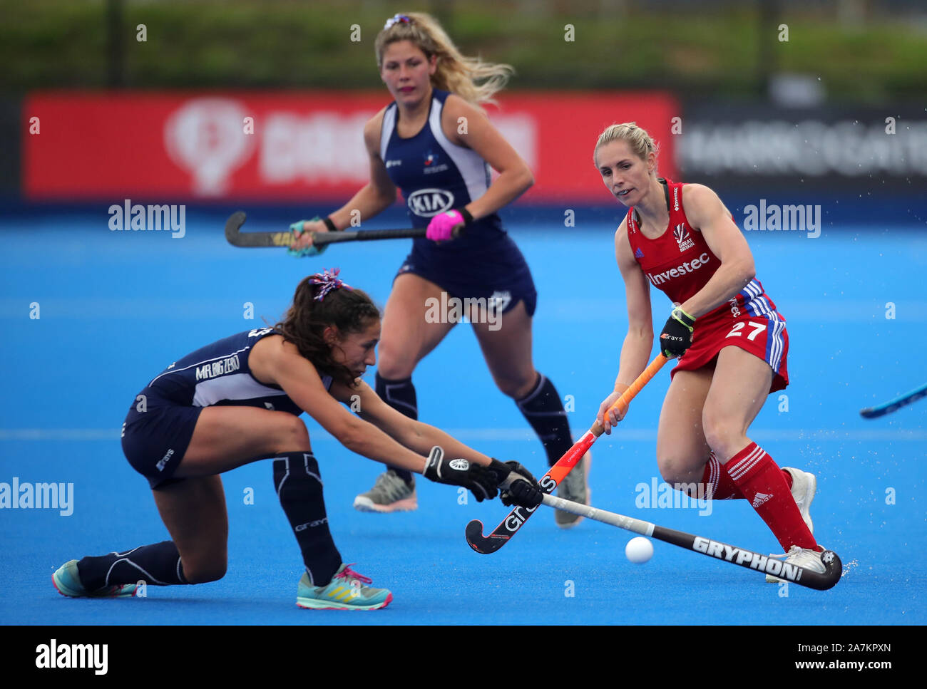 Great Britain's Jo Hunter (right) and Chile's Fernanda Flores during the FIH Hockey Olympic Qualifier at Lee Valley Hockey and Tennis Centre, London. Stock Photo