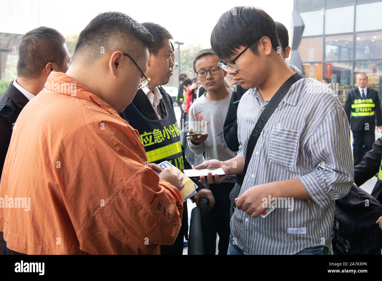 Consumers line up to buy the newly-released Adidas Yeezy, a ...