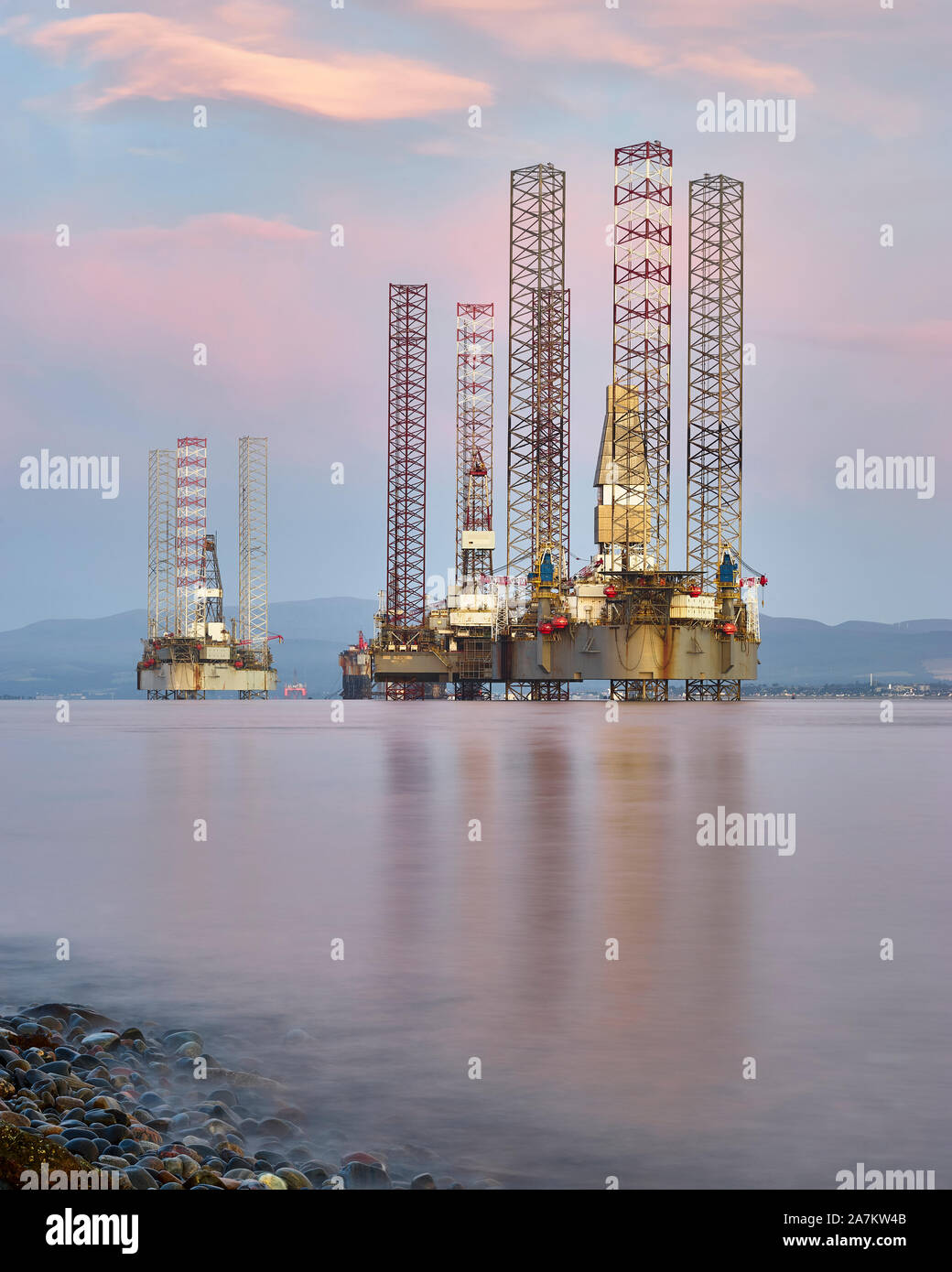 Oil rigs moored off Cromarty in the Cromarty Firth, Highland, Scotland. Stock Photo