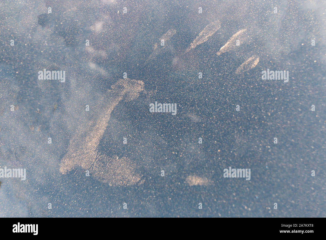 A close up view of a hand print on a very dirty and dusty window Stock Photo