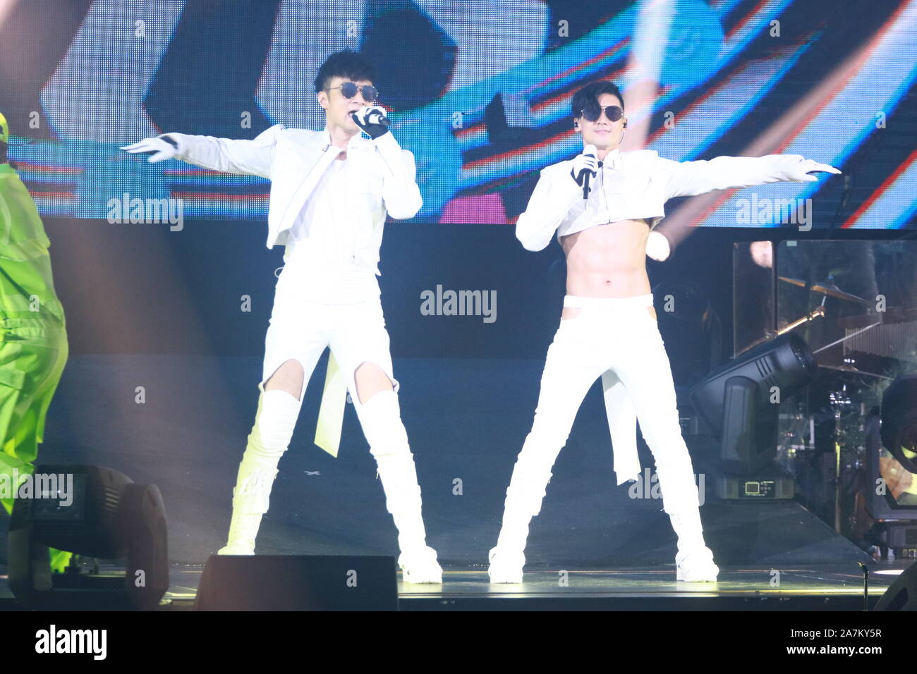 Hong Kong singer Leo Ku Kui Kei, right, appears and sings at a concert ...