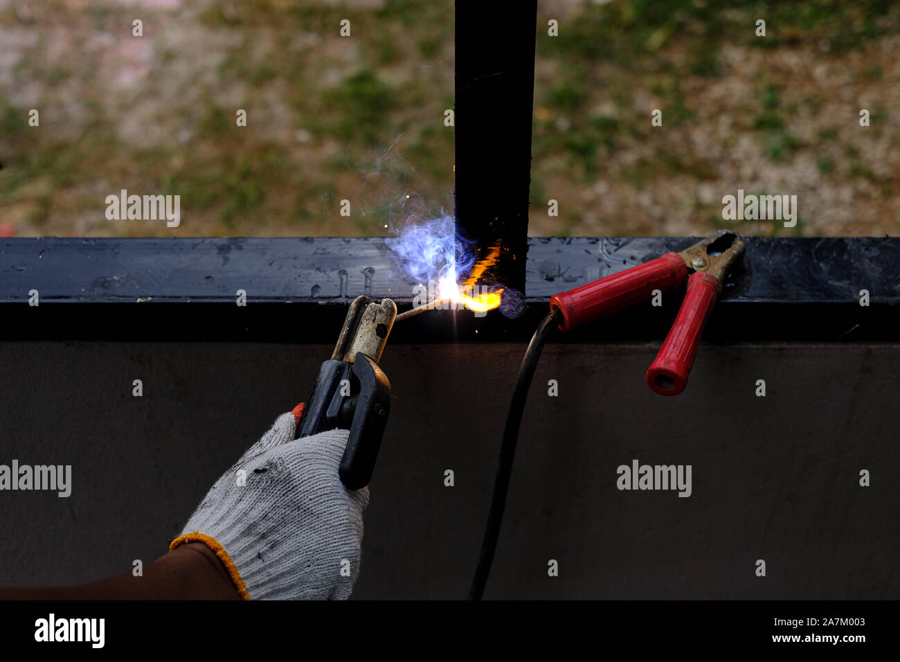 Welder Technician are welding steel with sparks flying Stock Photo Alamy