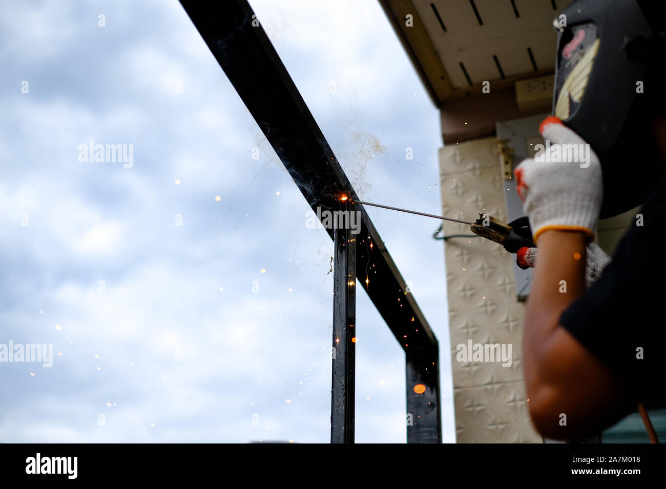 Welder Technician are welding steel with sparks flying Stock Photo Alamy