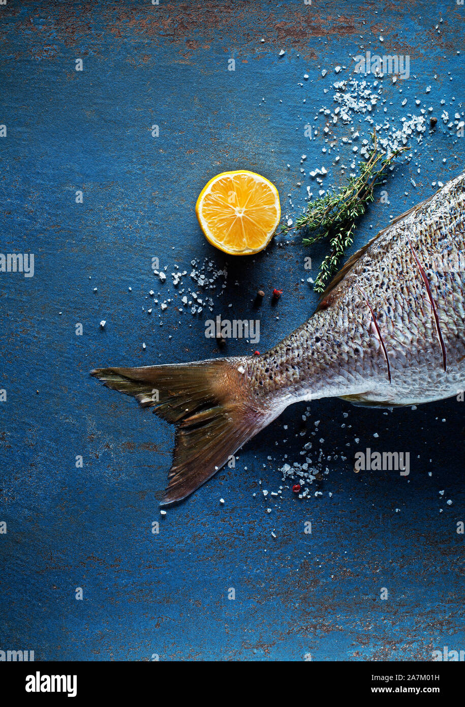 Delicious fresh fish on vintage background. Healthy diet eating or cooking concept Stock Photo