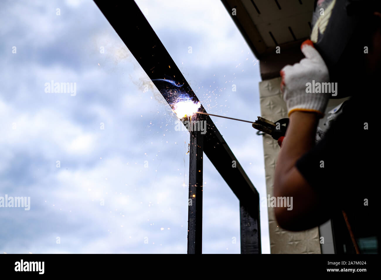 Welder Technician are welding steel with sparks flying Stock Photo Alamy