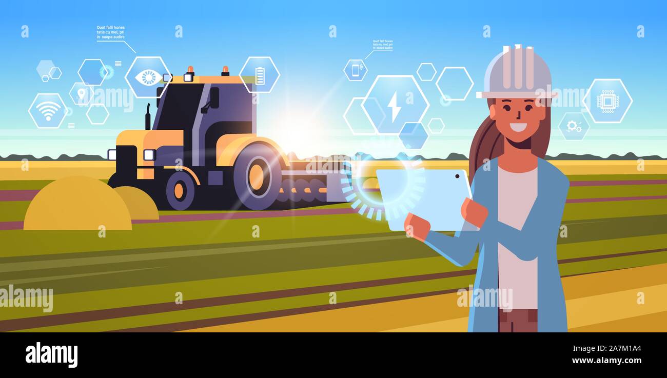 woman farmer with tablet controling tractor plowing field smart farming ...