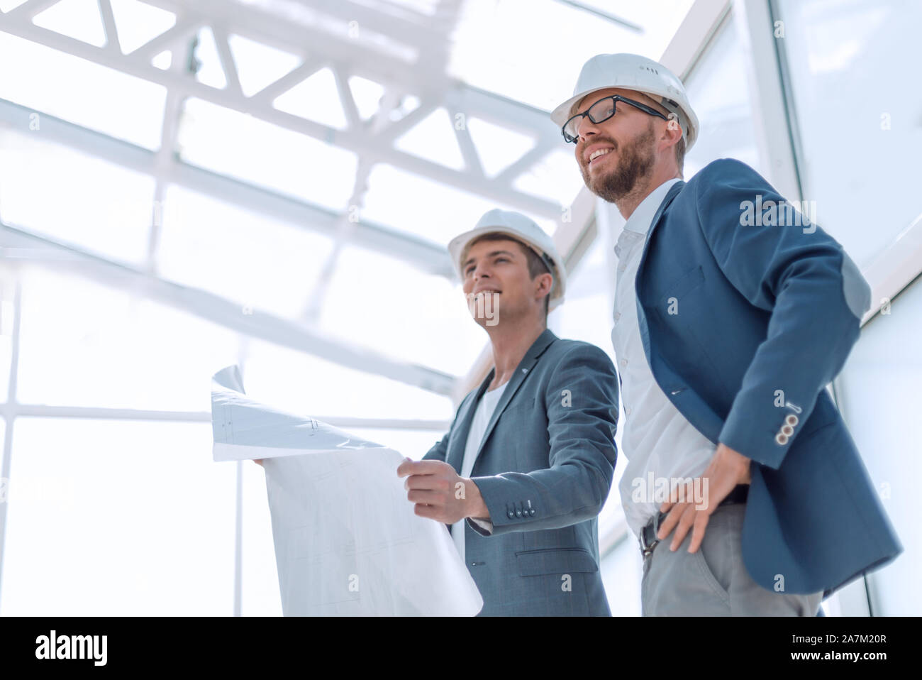 close up. architect and engineer standing in a spacious room Stock ...