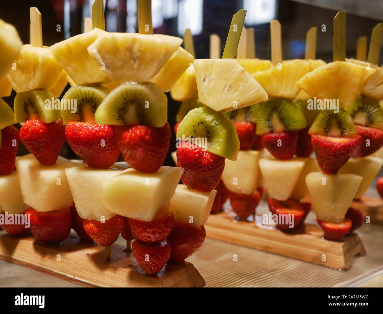 fruit skewers with pineapple kiwi and strawberry Stock Photo Alamy